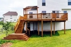Wood deck with sunburst rail and multi step platform