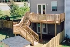 Upper level treated deck with multiple level stair case